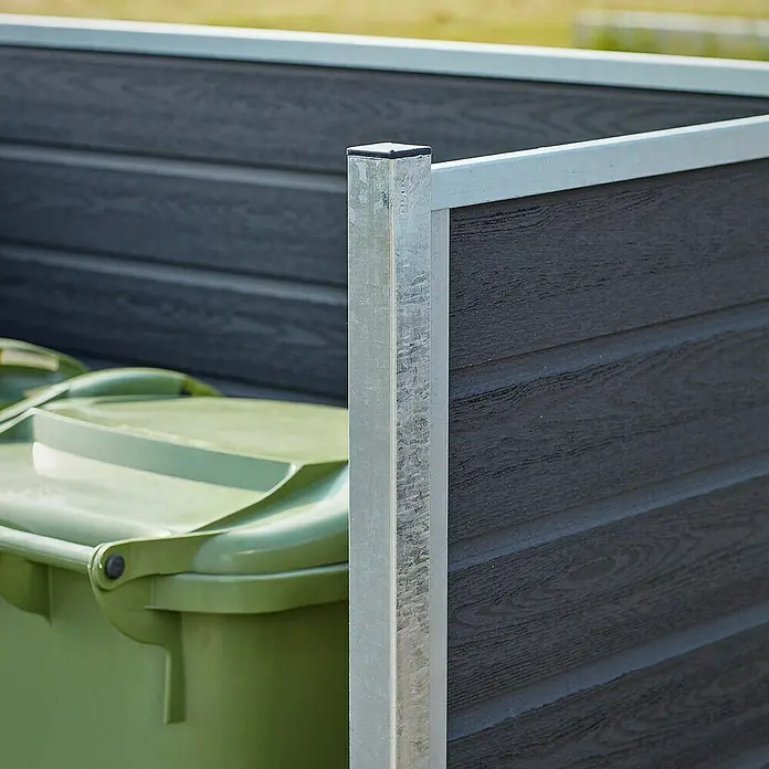 Plus Mülltonnenverkleidung Artura - Holz, Schiefergrau - Mülltonnenbox aus dunklem Holz und Metallrahmen mit einer grünen Mülltonne.