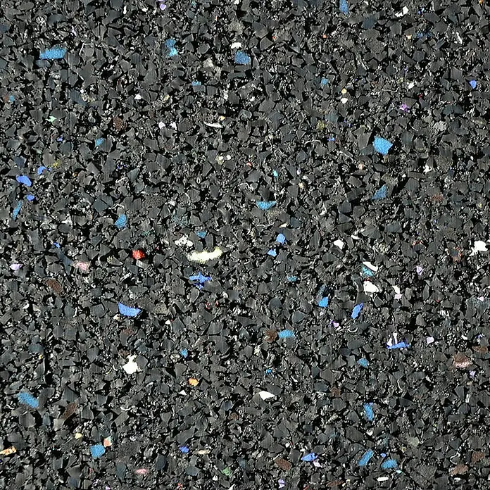 Floordirekt Unterlagsmatte Bautenschutzmatte Gummigranulatmatte 62,5 x 400 x 0,5 cm - Stärke: 5 mm - Nahaufnahme eines robusten Gummibodens mit farbigen Akzenten, ideal für Fitnessstudios und Spielplätze.