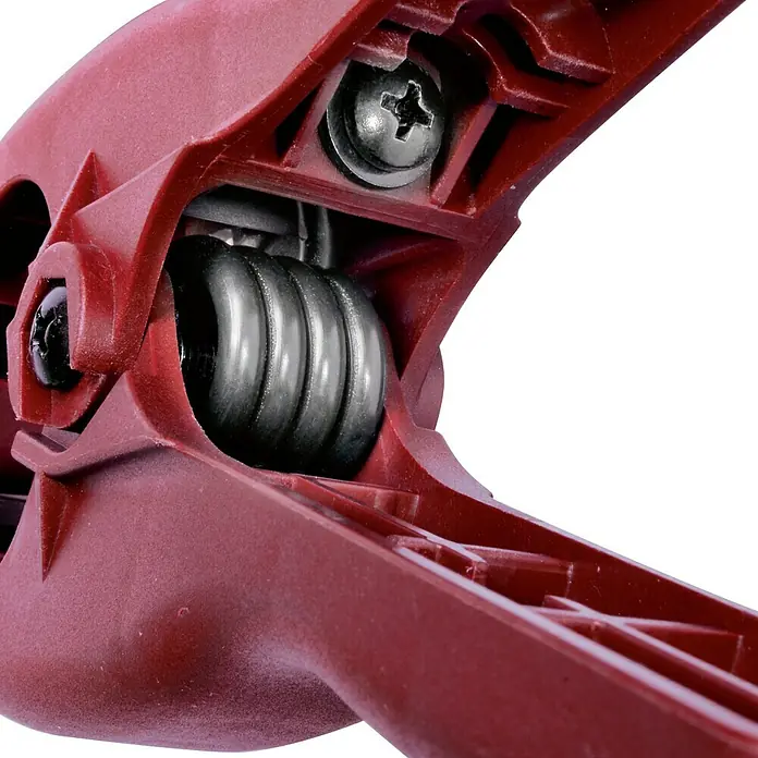 Piher Pinza con resorte 30910 - Anchura de sujeción: 30 mm - Primer plano de una pinza de resorte roja, que muestra la mecánica con tornillos y resorte.