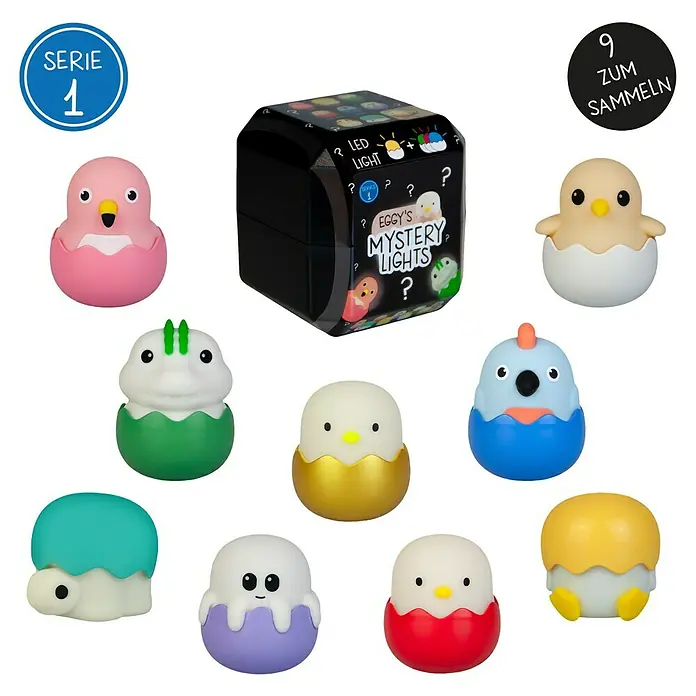 MegaLight LED-Nachtlicht Mystery Lights Eggys - 0,2 W, L x B x H: 45 x 45 x 50 mm, RGBW, Gesamtstückzahl: 1 Stk. - Abbildung von Eggy's Mystery Lights Serie 1, mit neun Sammelfiguren und einer schwarzen Überraschungsbox.
