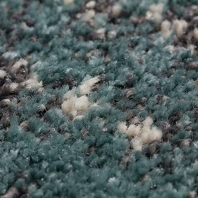 Dekoria Flachgewebeteppich - grau, türkis, 290 x 200 cm - Nahaufnahme eines Teppichs mit blauen, grauen und weißen Fasern, der eine weiche und strukturierte Oberfläche zeigt.
