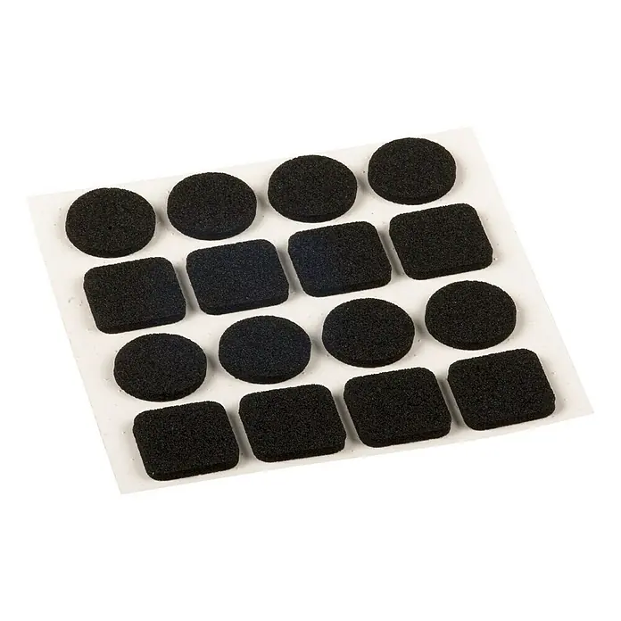 Stabilit Möbelgleiter - 16 Stk., Schwarz - Bild von einer Packung selbstklebender Möbelschoner in Schwarz, sowohl rund als auch quadratisch, die auf einer weißen Unterlage angeordnet sind.