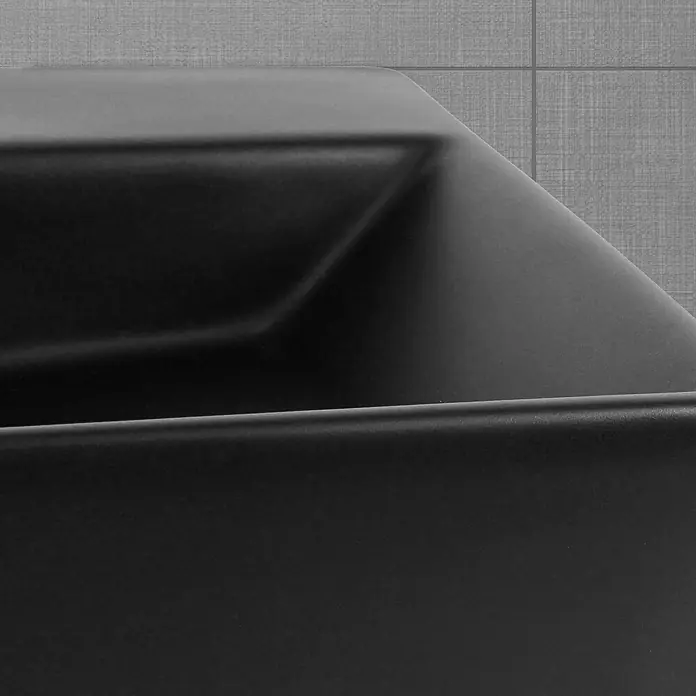 LuxeBath Aufsatzwaschbecken Waschtisch aus Keramik für Badezimmer / Gäste-WC - Ohne Spezialglasur, Schwarz - Nahaufnahme einer modernen, schwarzen Spüle, die durch ihr minimalistisches Design und die matte Oberfläche besticht und Eleganz ins Bad bringt.
