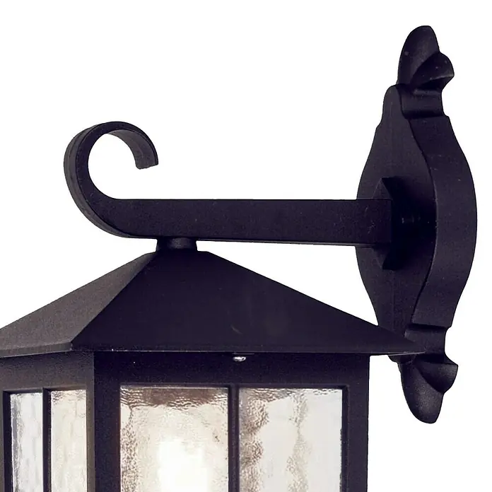Elstead Außenwandleuchte Winchester - 60 W, 23,7 x 33,5 x 33,5 cm, Schwarz, IP23 - Detailaufnahme einer schwarzen Außenwandleuchte mit klarem, strukturiertem Glas und dekorativer Halterung.