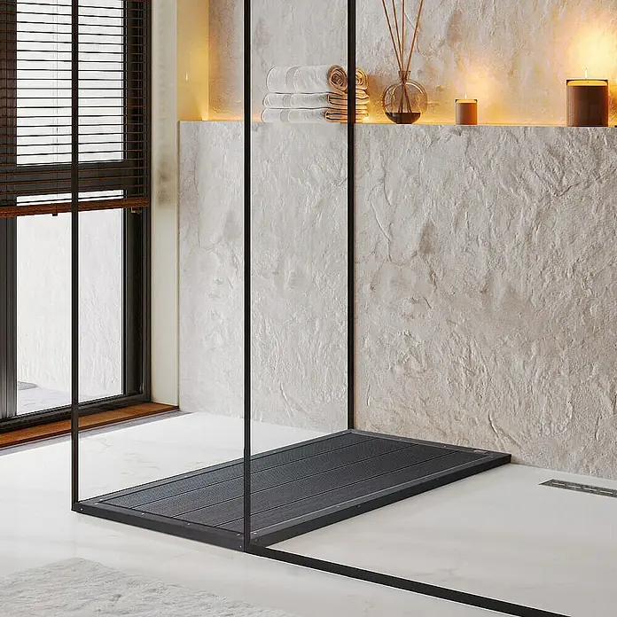 Home Deluxe Terrassenfliese GAIA - 105 cm x 63 cm x 55 mm, Anthrazit, Matt - Blick auf ein modernes Badezimmer mit einer eleganten, ebenerdigen Dusche mit dunkler Duschwanne und minimalistischem Design.