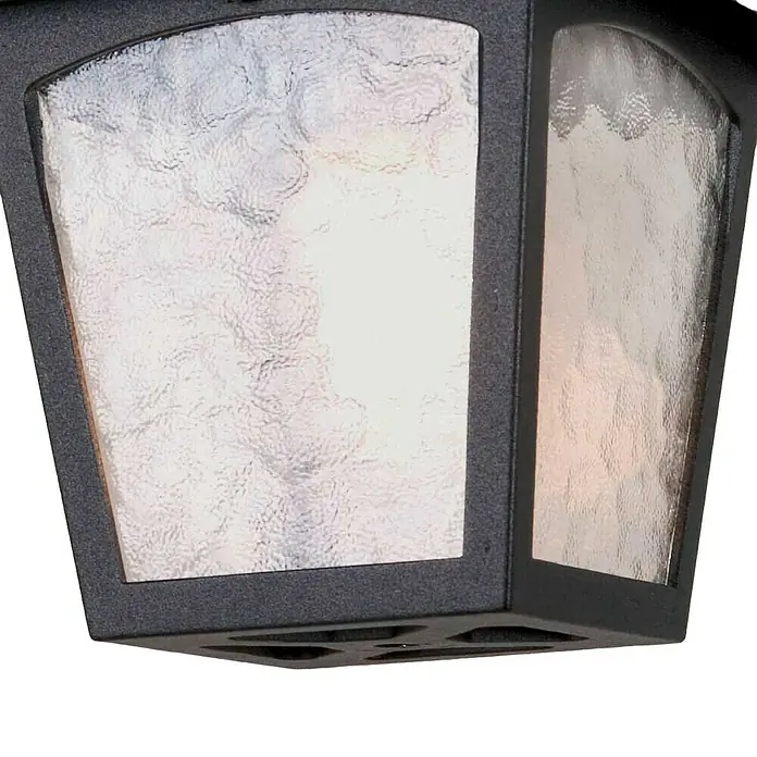 Elstead Außenleuchte York - 60 W, Farbe Gehäuse: Schwarz, 18,5 x 18,5 x 24,5 cm, Mit Leuchtmittel - Nahaufnahme einer schwarzen Außenleuchte mit strukturiertem Glas, die ein warmes Licht ausstrahlt und eine stilvolle Beleuchtung für den Außenbereich bietet.