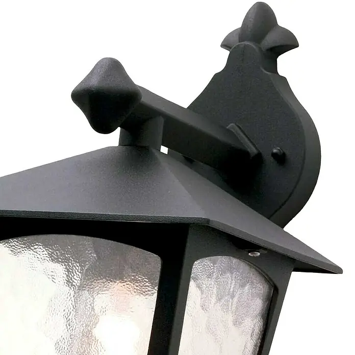 Elstead Außenwandleuchte York - 60 W, 22,5 x 31 x 31 cm, Schwarz, IP23 - Nahaufnahme einer schwarzen Wandleuchte mit strukturierter Glasabdeckung und dekorativen Elementen.