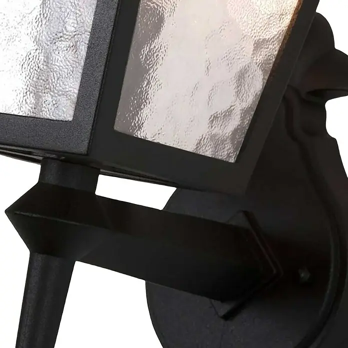 Elstead Außenwandleuchte York - 60 W, 23 x 43,5 x 43,5 cm, Schwarz, IP23 - Nahaufnahme einer schwarzen Außenleuchte mit strukturiertem Glas, die ein warmes Licht ausstrahlt. Stilvolles Design für den Außenbereich.