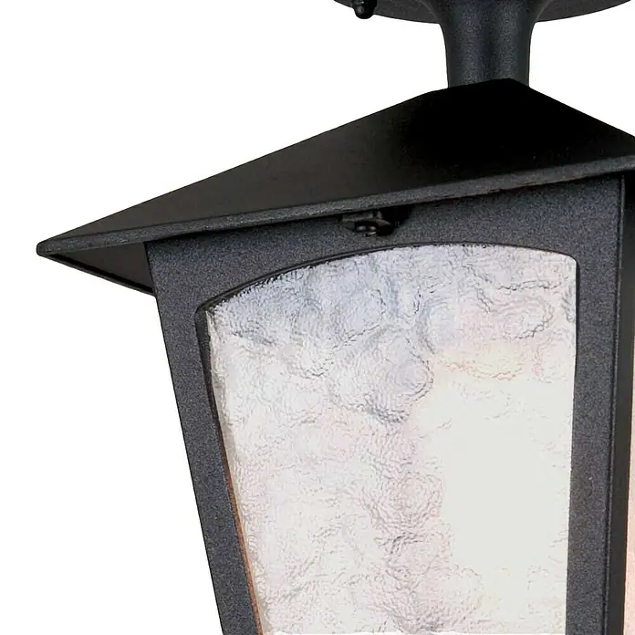 Elstead Außenleuchte York - 60 W, Farbe Gehäuse: Schwarz, 18,5 x 18,5 x 24,5 cm, Mit Leuchtmittel - Detailaufnahme einer schwarzen Außenleuchte mit strukturiertem Glas, die ein warmes Licht ausstrahlt.