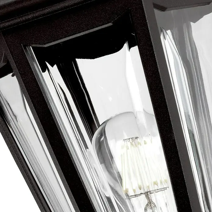Elstead Außenwandleuchte Kinsale - 60 W, 27 x 46 x 46 cm, Schwarz, IP44 - Nahaufnahme einer Außenleuchte mit klarem Glas und einer Edison-Glühbirne, die ein warmes, einladendes Licht ausstrahlt.