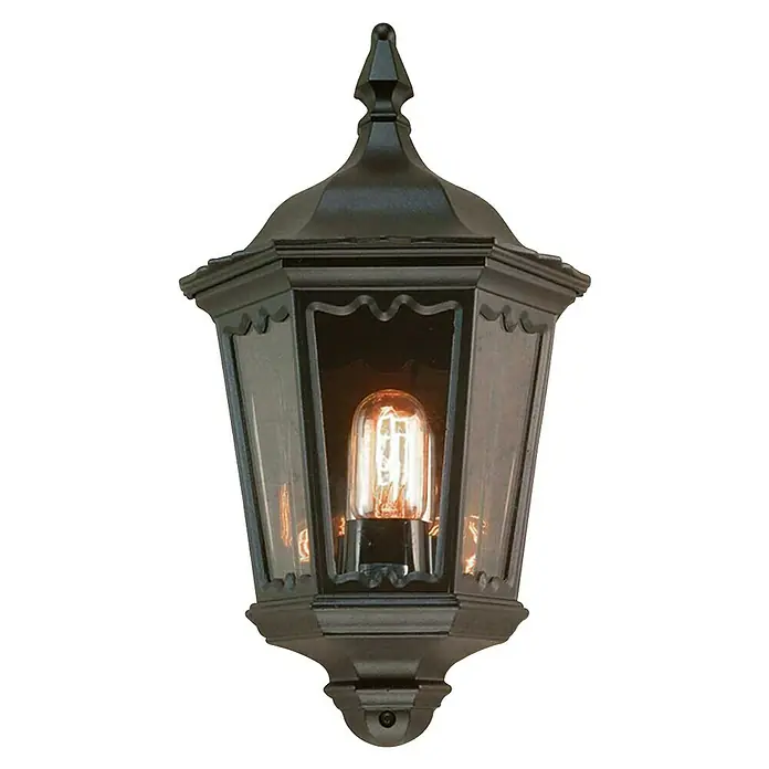 Elstead Außenwandleuchte Medstead - 60 W, 14 x 44,5 x 44,5 cm, Schwarz, IP44, Ohne Bewegungsmelder - Nahaufnahme einer klassischen schwarzen Aussenlaterne mit einer warm leuchtenden Glühbirne. Die Laterne hat ein sechseckiges Design und klare Scheiben.