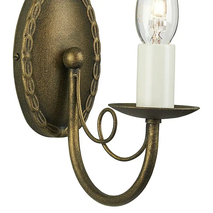 Elstead Wandleuchte Minster - 60 W, L x B x H: 17,5 x 8,5 x 19 cm, Schwarz/ Gold, E14, Anzahl Leuchtmittel: 1 Stk. - Nahaufnahme einer verzierten Wandleuchte in Goldbronze mit einer glühenden Glühbirne und einem dekorativen Design.