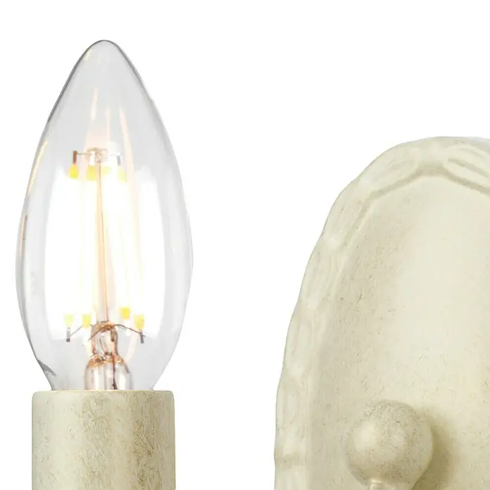 Elstead Wandleuchte Minster - 60 W, L x B x H: 17,5 x 8,5 x 19 cm, Elfenbein/ Gold, E14, Anzahl Leuchtmittel: 1 Stk. - Nahaufnahme einer dekorativen LED-Lampe in Tropfenform mit cremefarbenem Sockel, ideal für stimmungsvolle Beleuchtung.