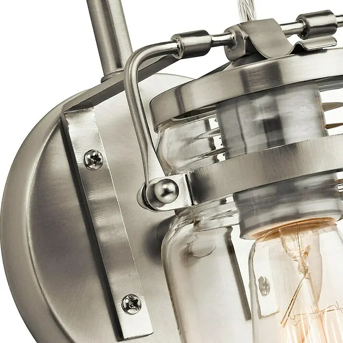 Elstead Wandleuchte Brinley - 60 W, L x B x H: 15,9 x 12,7 x 29,2 cm, Nickel, E27 - Nahaufnahme einer Wandleuchte im Vintage-Stil mit klaren Gläsern und einer Metalleinfassung in gebürstetem Nickel.