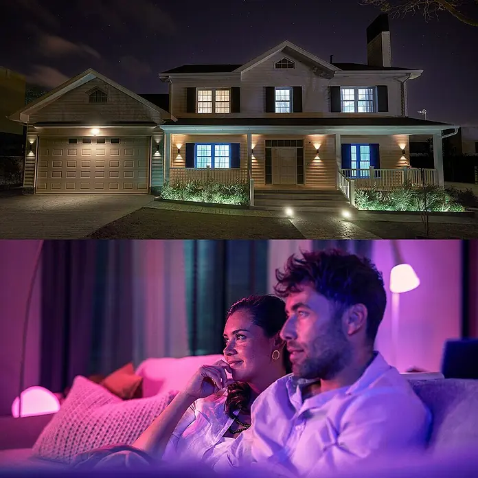 Philips Hue Smart-LED-Lampe Set Essential - GU10, Dimmbar, RGBW, 345 lm, 4,7 W, 1 Stk. - Hausbeleuchtung mit smarten Philips Hue Lampen, für Innen und Aussen, hier eine Familie beim gemütlichen Fernsehabend.