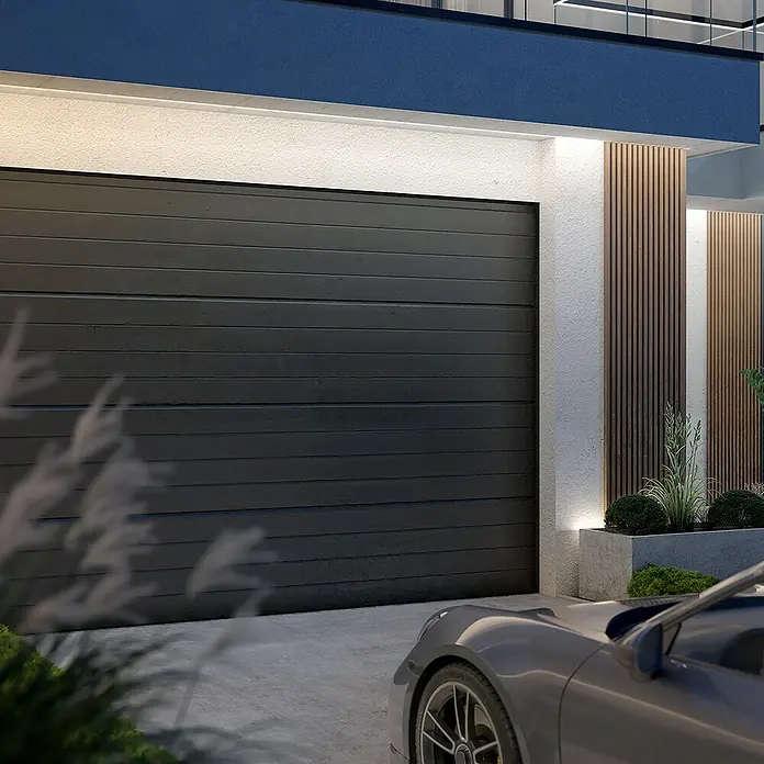 Philips Hue LED-Stripes Outdoor White and Colours Gradient Flux - Länge: 10 m, Lichtfarbe: RGBW, 3.000 lm, 30 W - Ein modernes Garagentor in Anthrazit fügt sich nahtlos in die Fassade ein. Beleuchtung betont die horizontale Struktur.