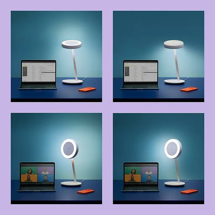 WiZ LED-Tischleuchte Portrait - 10 W, L x B x H: 20,4 x 19,5 x 38 mm, Weiß, Kaltweiß - Das Bild zeigt eine moderne Tischleuchte mit verstellbarem Licht, ideal für Büroarbeit und Videokonferenzen, zusammen mit einem Laptop und einem Smartphone.