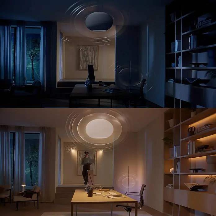 Philips Hue Smart-LED-Lampe Set mit Dimmcontroller, Steuerzentrale - E27, Dimmbar, RGBW, 2 Stk. - Das Bild zeigt einen modernen Raum mit einer innovativen Deckenleuchte, die mit Schallwellen-Technologie ausgestattet ist, in zwei Lichtstimmungen.