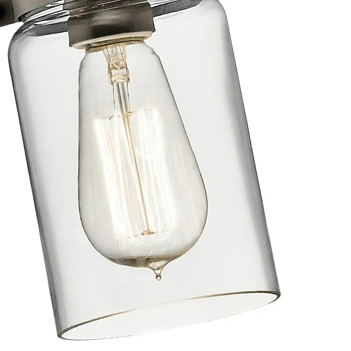 Elstead Pendelleuchte Brinley - 60 W, L x B x H: 12 x 12 x 25,6 cm, Bronze, E27 - Nahaufnahme einer klaren Glasleuchte mit einer Edison-Glühbirne, die ein warmes, einladendes Licht ausstrahlt.