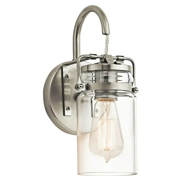 Elstead Wandleuchte Brinley - 60 W, L x B x H: 15,9 x 12,7 x 29,2 cm, Nickel, E27 - Nahaufnahme einer Wandleuchte mit Edison-Glühbirne, gebürstetem Nickel-Finish und klarem Glasgefäß, die ein warmes, einladendes Licht ausstrahlt.