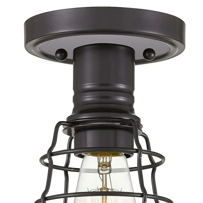 Elstead Deckenleuchte Mixon - 60 W, Ø x H: 14 x 27,1 cm, Nickel poliert, E27 - Nahaufnahme einer Deckenleuchte im Industrial-Stil mit einem Käfig und einer Glühbirne. Die Lampe ist in dunklen Farbtönen gehalten.