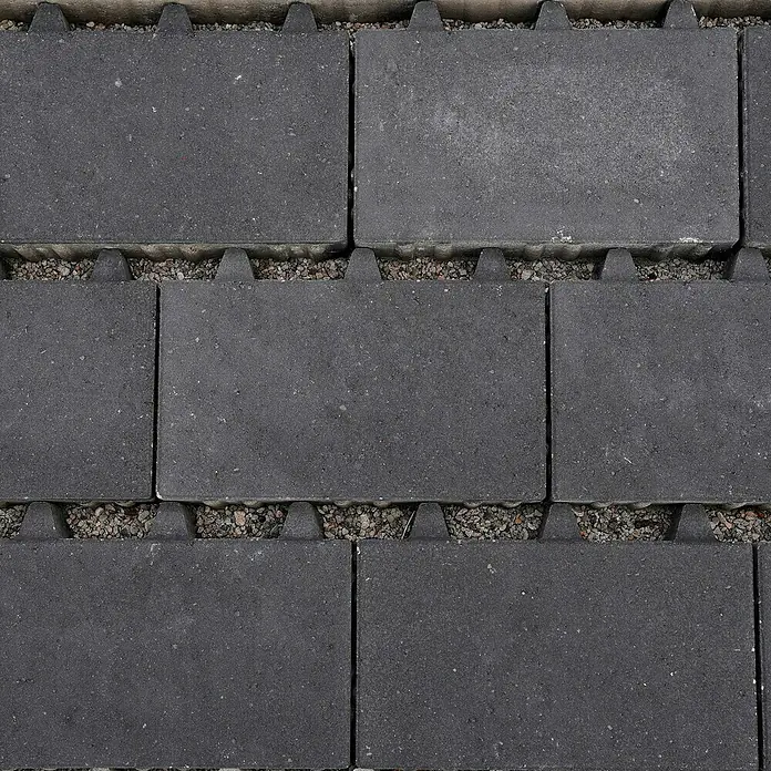 Diephaus Pflasterstein Lowell Rasenfugen - 30 x 20 x 6 cm, Anthrazit, Beton - Diese Aufnahme zeigt die Details von miteinander verbundenen Rasengittersteinen, ideal für befestigte und doch wasserdurchlässige Flächen im Garten.