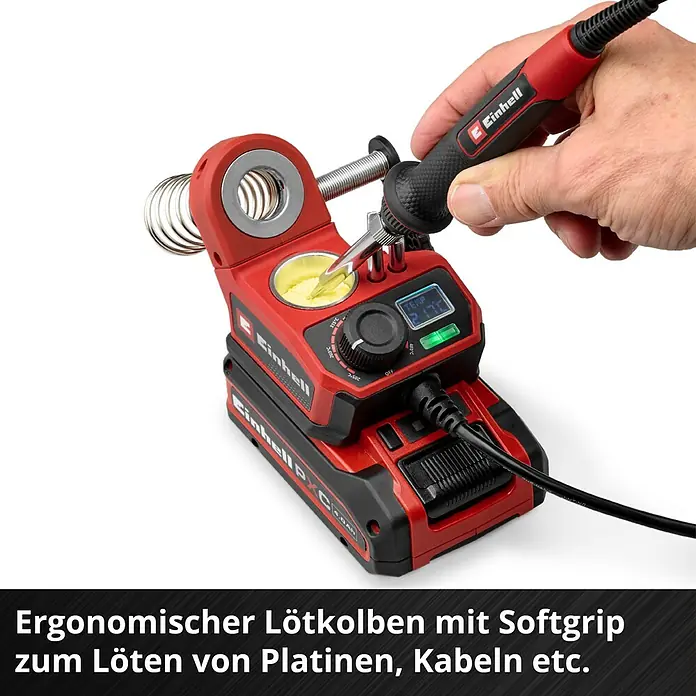 Einhell Power X-Change 18V Akku-Lötkolben TE-SI 18/480 LI E - Solo - 18 V - Ein roter Einhell Akku-Lötkolben mit Softgriff wird in eine Reinigungsstation getaucht, ideal zum Löten von Platinen und Kabeln.