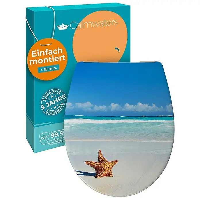 Calmwaters WC-Sitz Motiv Seestern - Duroplast, Mehrfarbig, Mit Absenkautomatik - Das Bild zeigt einen WC-Sitz mit einem Strandmotiv, bestehend aus einem Seestern, Sand, Meer und blauem Himmel, vor einem Produktkarton.