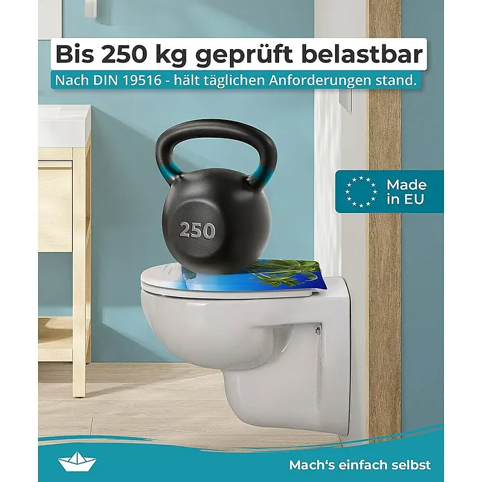 Calmwaters WC-Sitz Motiv Palmenparadies - Duroplast, Mehrfarbig, Mit Absenkautomatik - Das Bild zeigt eine Toilette, die mit einem 250 kg schweren Gewicht belastet ist, um ihre Stabilität und Belastbarkeit zu demonstrieren.