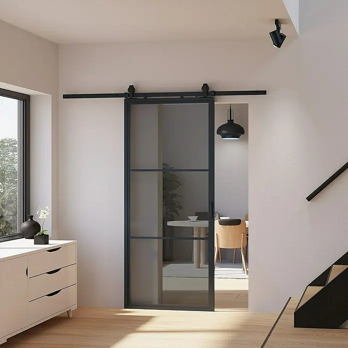 Inova Glasschiebetür Stahl Loft Grauglas Komplettset 3 Felder schwarz inkl. Softclose - 900 x 2.150 mm, Grauglas - Elegante Schiebetür aus Glas und Metall. Diese moderne Tür trennt Räume stilvoll und lässt gleichzeitig viel Licht durch.