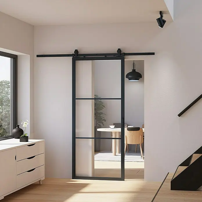 Inova Glasschiebetür Stahl Loft Klarglas Komplettset 3 Felder schwarz inkl. Softclose - Klarglas - Schiebetür mit schwarzem Rahmen und Glaseinsätzen, die einen Blick in den Essbereich freigibt. Elegantes Design für moderne Innenräume.