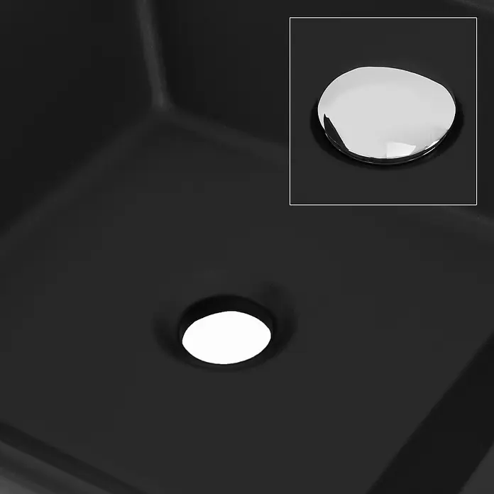 LuxeBath Aufsatzwaschbecken Waschtisch aus Keramik für Badezimmer / Gäste-WC - Ohne Spezialglasur, Schwarz - Nahaufnahme einer schwarzen Spüle mit glänzendem Stöpsel und Abflussloch, die das minimalistische Design und die Funktionalität hervorhebt.