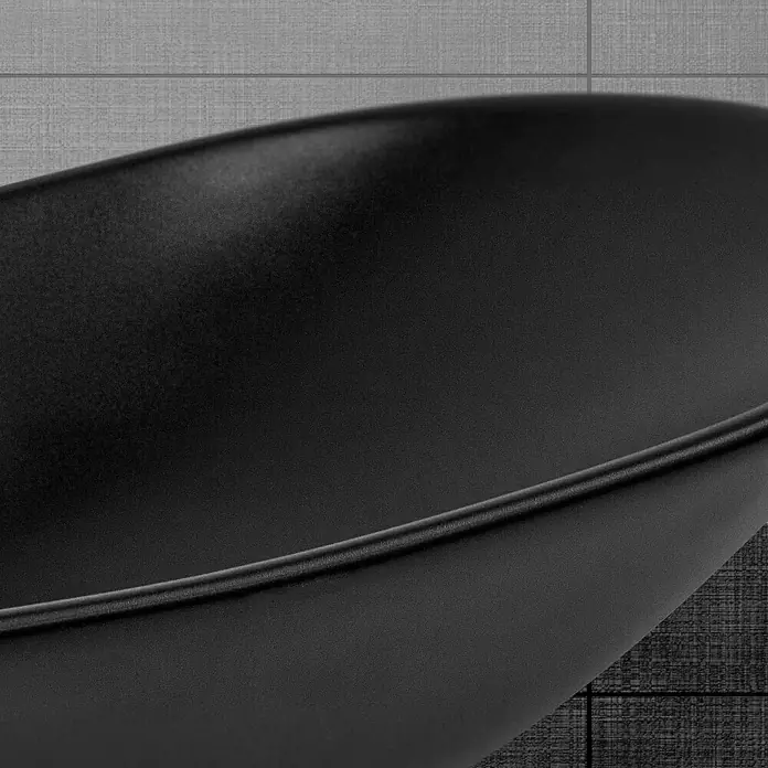 LuxeBath Aufsatzwaschbecken Oval 63x36x15,5 cm Schwarz Ablaufgarnitur Schwarz - Ohne Spezialglasur, Schwarz - Nahaufnahme einer eleganten, schwarzen Bratpfanne vor einem grauen Hintergrund, die modernes Design und Funktionalität vereint.