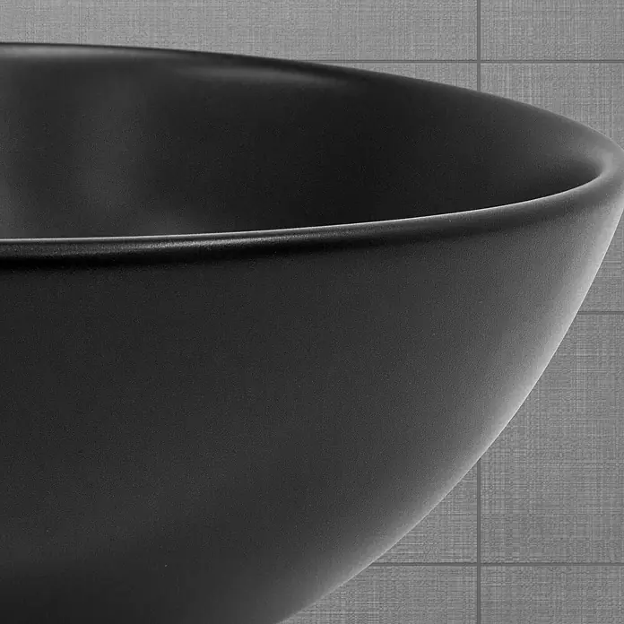 LuxeBath Aufsatzwaschbecken Aufsatzwaschtisch Handwaschbecken Rund Spülbecken - 28 x 28 cm, Ohne Spezialglasur, Schwarz - Nahaufnahme einer eleganten, mattschwarzen Waschschüssel, die durch ihr minimalistisches Design besticht und moderne Badezimmerästhetik unterstreicht.