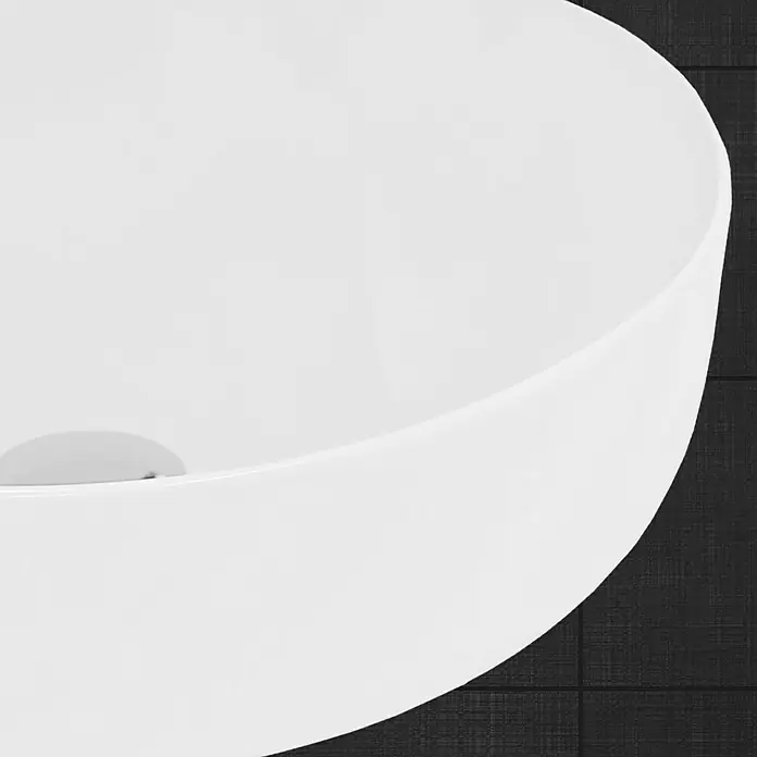 LuxeBath Aufsatzwaschbecken Aufsatzwaschtisch Handwaschbecken Waschschale Rund Spülbecken - Ohne Spezialglasur, Weiß - Nahaufnahme eines modernen, runden, weißen Waschbeckens mit elegantem Design vor einem dunklen Hintergrund.