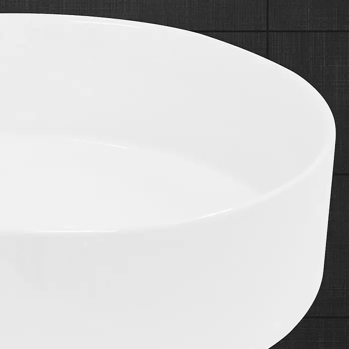 LuxeBath Aufsatzwaschbecken Handwaschbecken Waschplatz Rund für Badezimmer und für Gäste-WC - Ohne Spezialglasur, Weiß - Nahaufnahme einer weißen Keramikschale mit glatter Oberfläche vor dunklem Hintergrund. Eleganz und Schlichtheit vereint.