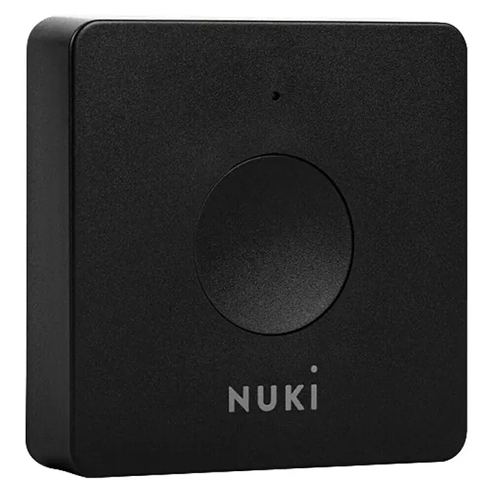 Nuki Control de apertura de puertas Opener - L x An x Al: 25 x 70 x 70 mm, WLAN - Primer plano del Nuki Opener, un dispositivo negro y cuadrado con un botón circular y el logotipo de Nuki en la parte inferior.