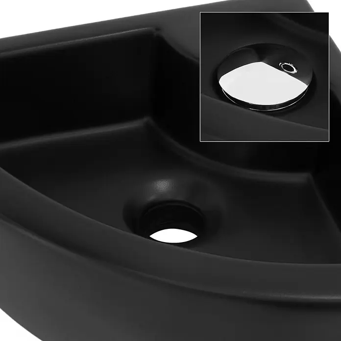 LuxeBath Aufsatzwaschbecken Waschtisch aus Keramik für Badezimmer / Gäste-WC - 33 x 46 cm, Ohne Spezialglasur, Schwarz - Nahaufnahme eines schwarzen Waschbeckens mit einem polierten Stöpsel und einem runden Abflussloch.