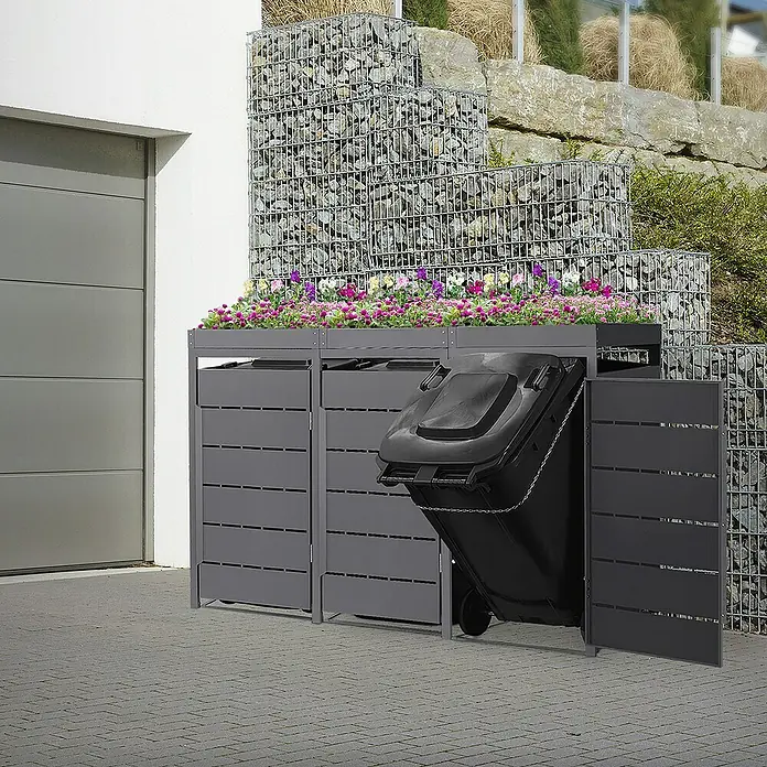 ML-Design Mülltonnenbox Mülltonnencontainer mit Pflanzdach für 3 Tonnen 120 oder 240 Liter - 80 x 80 cm, Stahl, Anthrazit, Geeignet für Anzahl Mülltonnen: 3 Stk. - Mülltonnenbox mit Bepflanzung auf Pflastersteinen vor einer Garage und Gabionenwand.