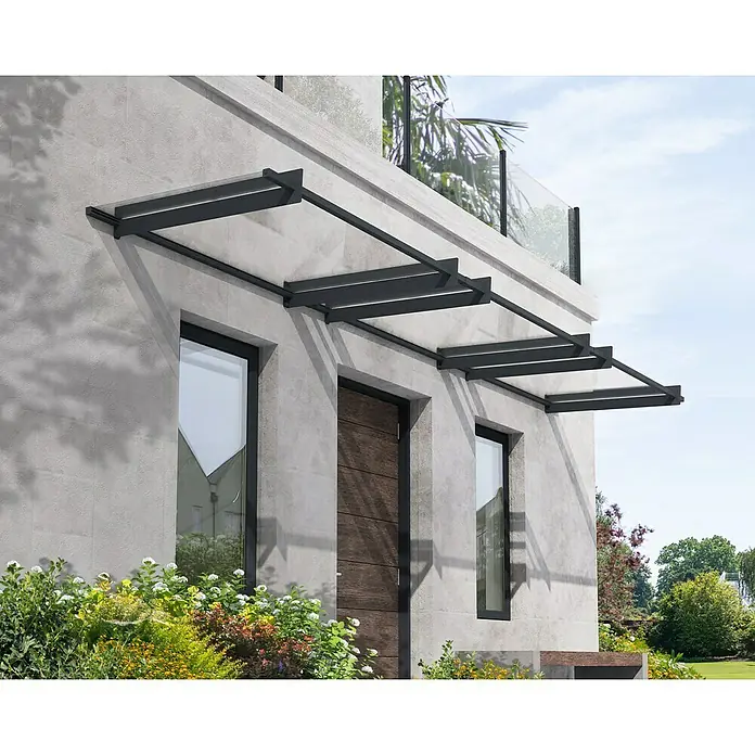 Palram – Canopia Pultvordach Nancy - 452 x 94 x 14 cm, Anthrazitgrau - Moderne Haustürüberdachung mit dunklen Metallrahmen und klarem Glas, die das Design des Gebäudes ergänzt und Schutz bietet.