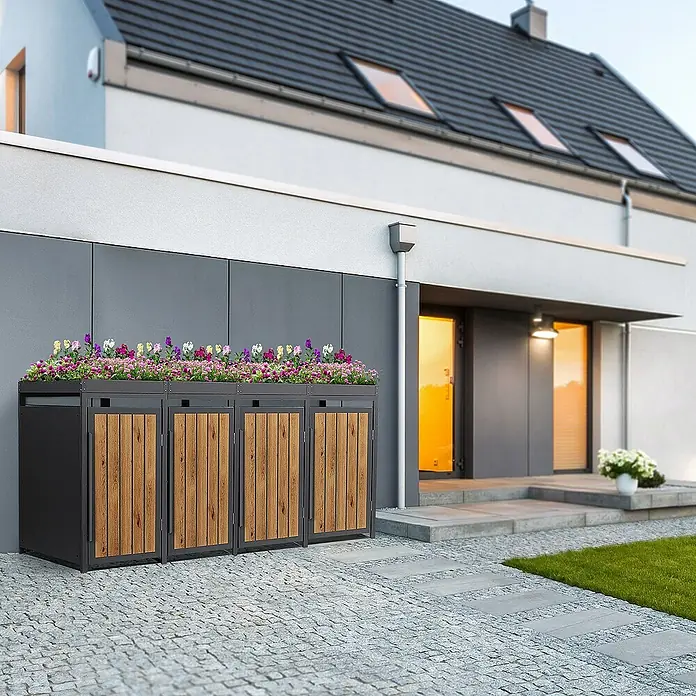 ML-Design Mülltonnenbox Mülltonnencontainer mit Pflanzdach für 4 Tonnen 120 oder 240 Liter - 80 x 80 cm, Stahl, Eiche hell, Geeignet für Anzahl Mülltonnen: 4 Stk. - Eine Mülltonnenbox mit Holzverkleidung und Blumen bepflanzt, die das Gesamtbild aufwertet und eine schöne Optik bietet.