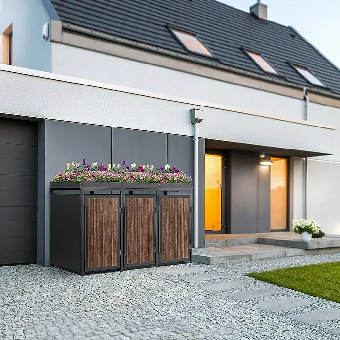 ML-Design Mülltonnenbox Mülltonnencontainer mit Pflanzdach für 3 Tonnen 120 oder 240 Liter - Stahl, Eiche dunkel, Geeignet für Anzahl Mülltonnen: 4 Stk. - Mülltonnenbox mit Bepflanzung vor modernem Haus. Die Box ist aus dunklem Metall und Holz gefertigt und bietet Platz für drei Tonnen.
