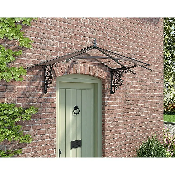 Palram – Canopia Pultvordach Lily - 174,5 x 125 x 80 cm, Anthrazit - Vordach mit dekorativen Schmiedeeisenhalterungen über einer Haustür.
