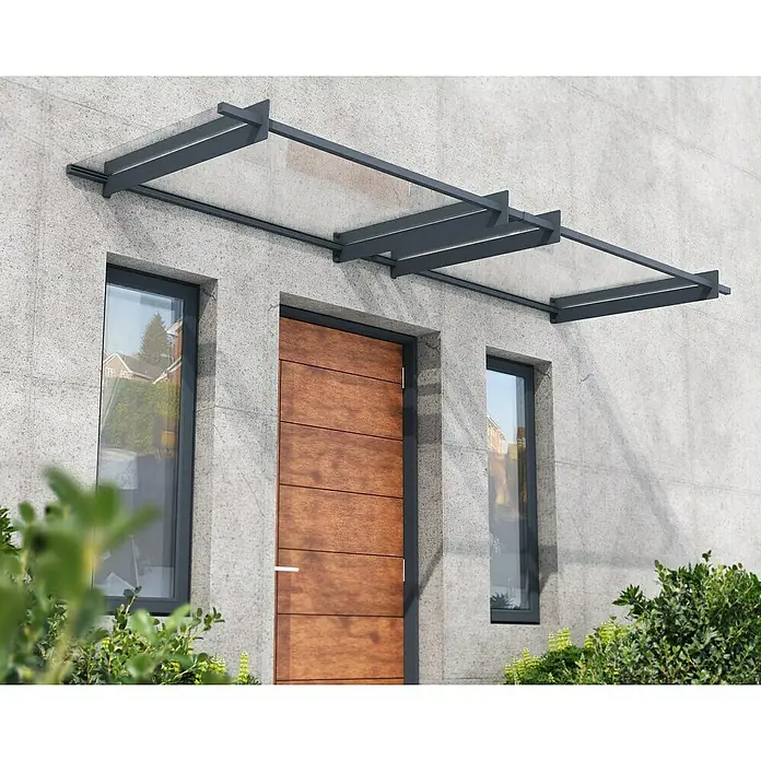 Palram – Canopia Pultvordach Nancy - 301 x 94 x 14 cm, Anthrazitgrau - Vordach aus Glas und Metall über einer Haustür, das moderne Design und Funktionalität vereint und Schutz vor Witterung bietet.