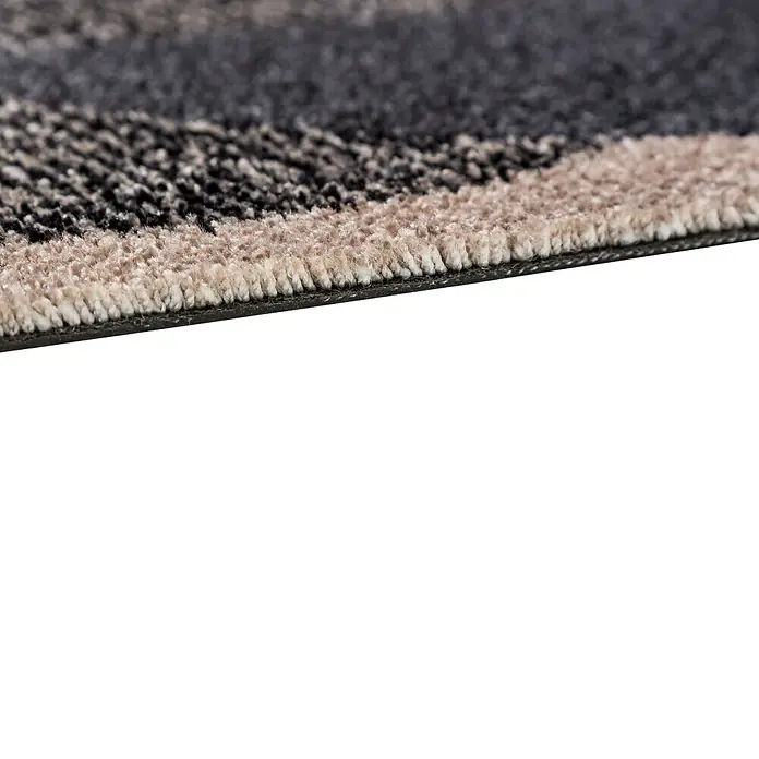 Fußmatte Manhatten - Beige/Anthrazit, 70 x 50 cm, 100 % Polyamid - Nahaufnahme eines Teppichs mit abstraktem Muster in Grau- und Beigetönen, der eine weiche und strukturierte Oberfläche zeigt.