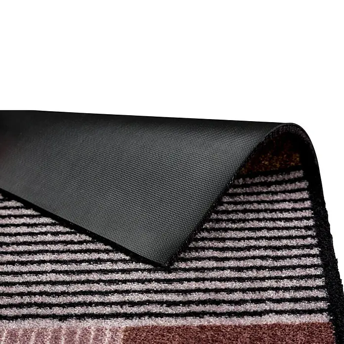 Fußmatte Manhatten - Geomix Kastanie/Rose, 100 x 67 cm, 100 % Polyamid - Nahaufnahme einer Fußmatte mit Streifenmuster und schwarzer Rückseite, ideal für den Eingangsbereich und zur Schmutzabweisung.