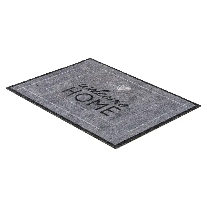 Fußmatte Deco Brush - Beton, 70 x 50 cm, 100 % Polyamid - Graue Fußmatte mit der Aufschrift "Welcome Home" und einem Herzdesign, perfekt für den Eingangsbereich, um Gäste zu begrüßen.