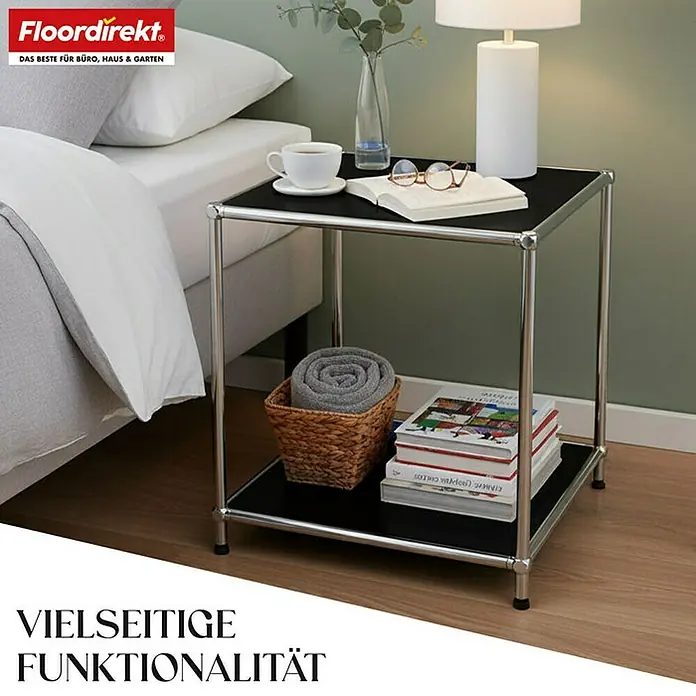 Floordirekt Metallregal Concept Epure MK-012 - 40 x 40 x 46 cm Schwarz - H x B x T: 46 x 40 x 40 cm, Anzahl Böden: 2 Stk., Schrauben, Schwarz - Ein schwarzer Nachttisch mit Stahlrahmen präsentiert Dekoartikel neben einem Bett.