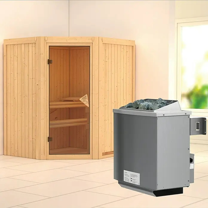 Karibu Elementsauna Taurin - Mit 9 kW Ofen mit integrierter Steuerung, Ohne Dachkranz, L x B x H: 170 x 151 x 192 cm - Ein Bild einer Sauna mit einem Saunaofen. Die Sauna ist aus Holz und der Ofen ist mit Steinen gefüllt.