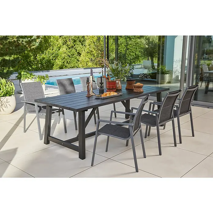 Sunfun Gartenmöbel-Set Melina/Maja - 7 -tlg., Akazie, Aluminium, Textilen, Schwarz/Grau - Eine stilvolle Gartentischgruppe mit grauem Tisch und sechs passenden Stühlen auf einer sonnigen Terrasse.